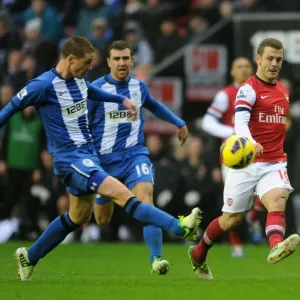 Jack Wilshere vs. James McCarthy: Intense Battle in Wigan Athletic vs. Arsenal (2012-13 Premier League)