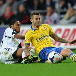 Jack Wilshere vs. Jonathan De Guzman: Intense Tackle in Swansea City vs. Arsenal Premier League Clash Jack Wilshere vs. Jonathan De Guzman: Intense Tackle in Swansea City vs. Arsenal Premier League Clash