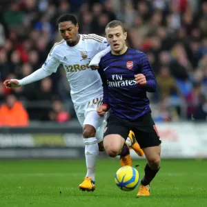 Jack Wilshere vs. Jonathan de Guzman: Swansea v Arsenal - FA Cup Third Round Jack Wilshere vs. Jonathan de Guzman: Swansea v Arsenal - FA Cup Third Round