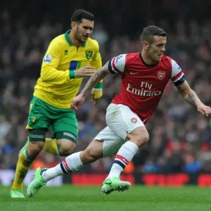 Jack Wilshere's Agile Moves: Outmaneuvering Norwich's Bradley Johnson in the 2012-13 Arsenal Victory Jack Wilshere's Agile Moves: Outmaneuvering Norwich's Bradley Johnson in the 2012-13 Arsenal Victory