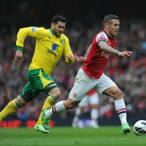 Jack Wilshere's Agile Moves: Outsmarting Norwich's Bradley Johnson in the 2012-13 Arsenal Showdown Jack Wilshere's Agile Moves: Outsmarting Norwich's Bradley Johnson in the 2012-13 Arsenal Showdown