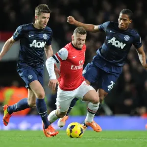 Jack Wilshere's Agile Outmaneuver: Arsenal Star Outwits Michael Carrick and Antonio Valencia (2013-14)