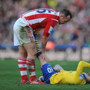 Jack Wilshere's Injury Woes: Charlie Adam Consoles the Arsenal Star During Stoke vs Arsenal Match (2013-14)