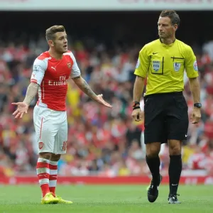 Jack Wilshere's Passionate Protest: Arsenal Star Faces Off with Referee Mark Clattenburg during Arsenal vs Manchester City (2014-15)