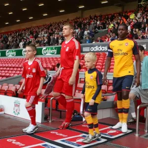 Jay Thomas (Arsenal) leads out the team with the Arsenal Mascot Jay Thomas (Arsenal) leads out the team with the Arsenal Mascot