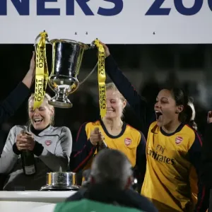 Jayne Ludlow and Alex Scott (Arsenal) lift the League Cup Trophy