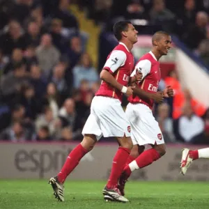 Jeremie Aliadiere celebrates scoring his and Arsenals 2nd goal with Armand Traore