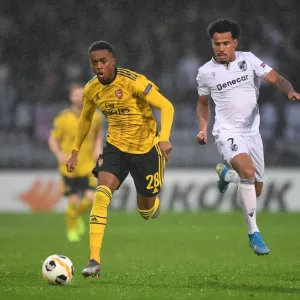 Joe Willock Clashes with Lucas Evangelista in Arsenal's Europa League Battle against Vitoria Guimaraes Joe Willock Clashes with Lucas Evangelista in Arsenal's Europa League Battle against Vitoria Guimaraes
