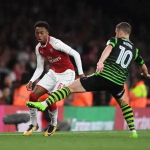 Joe Willock vs. Tommy Rowe: Intense Battle in Arsenal's Carabao Cup Clash Against Doncaster Joe Willock vs. Tommy Rowe: Intense Battle in Arsenal's Carabao Cup Clash Against Doncaster
