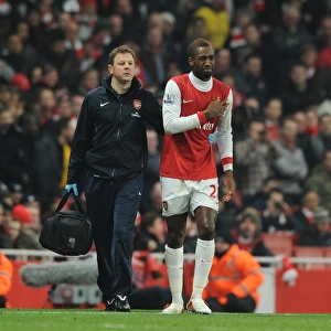 Johan Djourou with Arsenal physio Colin Lewin. Arsenal 2: 1 Everton, Barclays Premier League