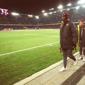 Johan Djourou, Arturo Lupoli and Cesc Fabregas (Arsenal) make their way to the substitutes bench aft