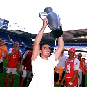Jose Reyes (Arsenal) celebrates winning the League with an inflatable trophy