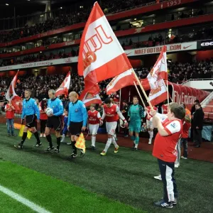 The Junior Gunners do a guard of honour as the teams walk out. Arsenal 2: 0 Wigan Athletic