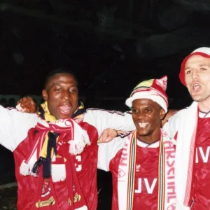 Kevin Campbell, Paul Davis and Steve Bould celebrate winning the League Championship