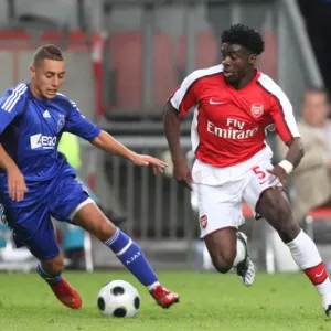 Kolo Toure (Arsenal) Ismail Assati (Ajax) Kolo Toure (Arsenal) Ismail Assati (Ajax)