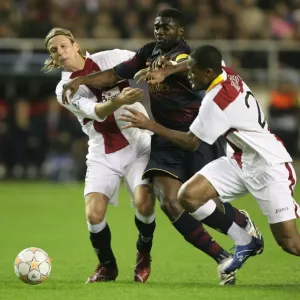 Kolo Toure (Arsenal) Seydou Keita & Christian Poulsen(Seville) Kolo Toure (Arsenal) Seydou Keita & Christian Poulsen(Seville)