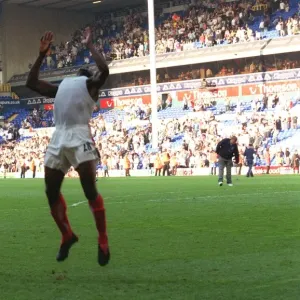 Kolo Toure celebrates by performing a back flip across the pitch Kolo Toure celebrates by performing a back flip across the pitch