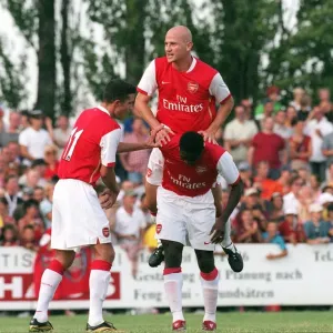 Kolo Toure celebrates scoring a goal for Arsenal with Pascal Cygan and Robin van Persie
