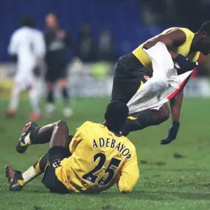 Kolo Toure and Emmanuel Adebayor celebrate after the match
