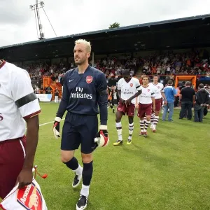 Kolo Toure and Manuel Almunia (Arsenal) lead the team out Kolo Toure and Manuel Almunia (Arsenal) lead the team out