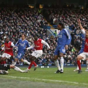 Kolo Toure and Mathieu Flamini celebrate Arsenals goal scored past Carlo Cudicini