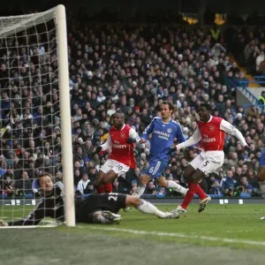 Kolo Toure and Mathieu Flamini celebrate Arsenals goal scored past Carlo Cudicini