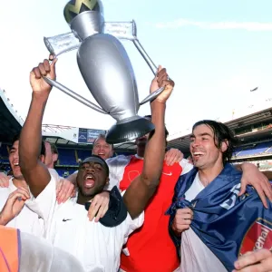 Kolo Toure and Robert Pires (Arsenal) celebrate winning the League Kolo Toure and Robert Pires (Arsenal) celebrate winning the League