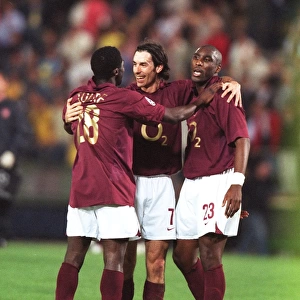 Kolo Toure, Robert Pires and Sol Campbell (Arsenal) celebrate at the end of the match