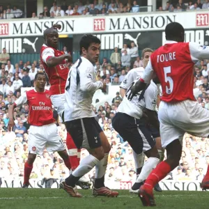 Kolo Toure shoots past Tottenham goalkeeper PAul Robinson to score the 1st Arsenal goal