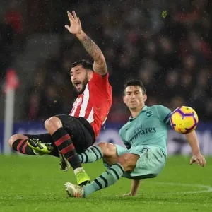 Koscielny vs. Austin: A Premier League Battle - Arsenal's Laurent Koscielny Clashes with Southampton's Charlie Austin (December 2018)