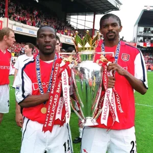 Lauren and Kanu lift the F. A. Barclaycard Premiership Trophy