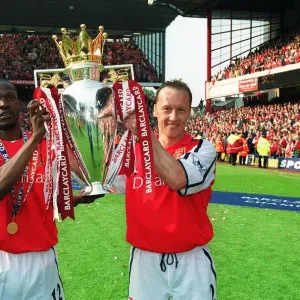 Lauren and Lee Dixon (Arsenal) lift the F. A. Barclaycard Premiership Trophy Lauren and Lee Dixon (Arsenal) lift the F. A. Barclaycard Premiership Trophy