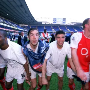 Lauren, Robert Pires, Jose Reyes and Dennis Bergkamp celebrate winning the League Lauren, Robert Pires, Jose Reyes and Dennis Bergkamp celebrate winning the League