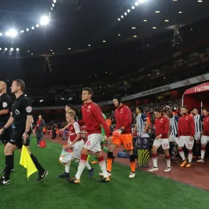 Laurent Koscielny (Arsenal) leads out the team. Arsenal 2: 0 West Bromwich Albion Laurent Koscielny (Arsenal) leads out the team. Arsenal 2: 0 West Bromwich Albion