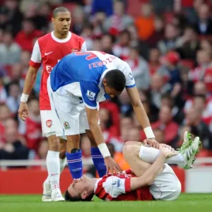 Laurent Koscielny (Arsenal) lies injuered following a challenge from Steven N Zonzi