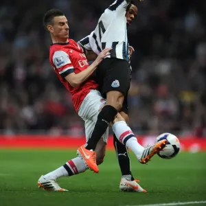 Laurent Koscielny (Arsenal) Loic Remy (Newcastle). Arsenal 2: 0 Newcastle United Laurent Koscielny (Arsenal) Loic Remy (Newcastle). Arsenal 2: 0 Newcastle United