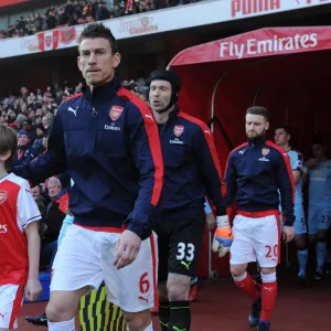 Laurent Koscielny (Arsenal) with the mascot before the match. Arsenal 2: 1 Burnley