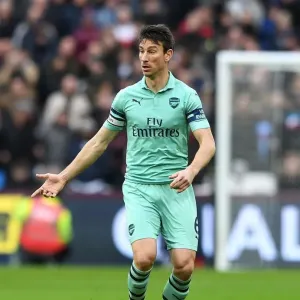 Laurent Koscielny Focused Amidst the Action: West Ham United vs Arsenal FC, Premier League 2018-19 Laurent Koscielny Focused Amidst the Action: West Ham United vs Arsenal FC, Premier League 2018-19