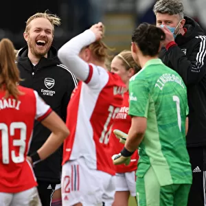 A Light-Hearted Moment: Arsenal's Jonas Eidevall and Manuela Zinsberger Share a Laugh on the Sidelines during Arsenal Women vs Manchester United Women