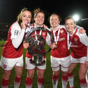 Print of four footballers with the Continental Cup Trophy
