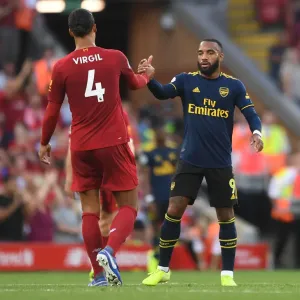 Liverpool vs. Arsenal: Lacazette and Van Dijk Share a Moment after Intense Premier League Clash (2019-20) Liverpool vs. Arsenal: Lacazette and Van Dijk Share a Moment after Intense Premier League Clash (2019-20)