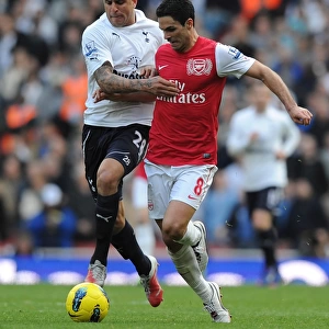 LONDON, ENGLAND - FEBRUARY 26: Mikel Arteta of Arsenal challenged by Kyle Walker of Tottenham during the Barclays Premier League match between Arsenal and Tottenham Hotspur at Emirates Stadium on February 26, 2012 in London, England. (Photo by Stuart MacFarlane / Arsenal FC via