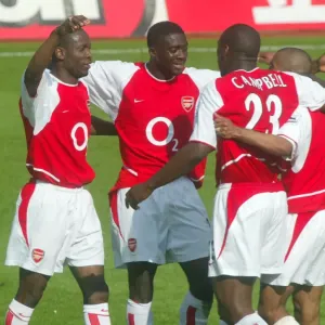 (L>R) Lauren, Kolo Toure, Sol Campbell and Ashley Cole celebrate at the end of the match (L>R) Lauren, Kolo Toure, Sol Campbell and Ashley Cole celebrate at the end of the match