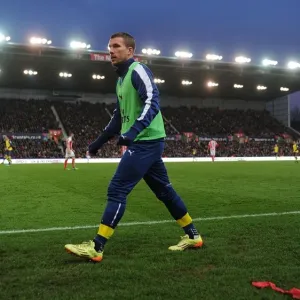 Lukas Podolski in Action: Stoke City vs Arsenal, Premier League 2014-15 Lukas Podolski in Action: Stoke City vs Arsenal, Premier League 2014-15