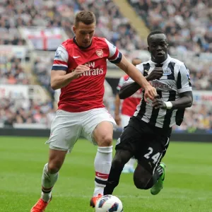 Lukas Podolski Breaks Past Cheik Tiote: Newcastle United vs. Arsenal, Premier League 2012-13 Lukas Podolski Breaks Past Cheik Tiote: Newcastle United vs. Arsenal, Premier League 2012-13