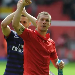 Lukas Podolski Celebrates with Arsenal Fans: Liverpool vs Arsenal, Premier League 2012-13 Lukas Podolski Celebrates with Arsenal Fans: Liverpool vs Arsenal, Premier League 2012-13