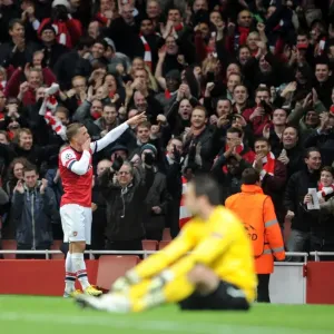 Lukas Podolski celebrates scoring Arsenals 2nd goal. Arsenal 2: 0 Montpellier. UEFA