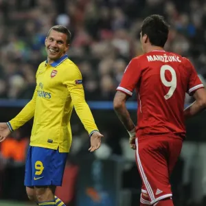Lukas Podolski and Mario Mandzukic Share a Light-Hearted Moment Amidst UEFA Champions League Rivalry Lukas Podolski and Mario Mandzukic Share a Light-Hearted Moment Amidst UEFA Champions League Rivalry