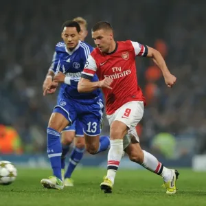 Lukas Podolski Outmaneuvers Jermaine Jones in Arsenal's UEFA Champions League Clash Lukas Podolski Outmaneuvers Jermaine Jones in Arsenal's UEFA Champions League Clash