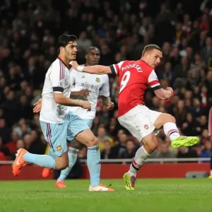 Lukas Podolski Scores Third Goal Past James Tomkins in Arsenal's Victory over West Ham United Lukas Podolski Scores Third Goal Past James Tomkins in Arsenal's Victory over West Ham United